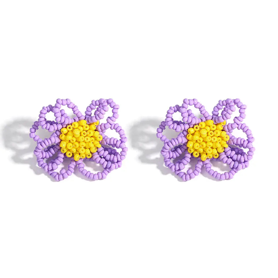 This dainty daisy clip-on pair of earrings is made of lavender and yellow seed beads, shop the best gift gifts for her for him from Inna carton online store dubai, UAE!